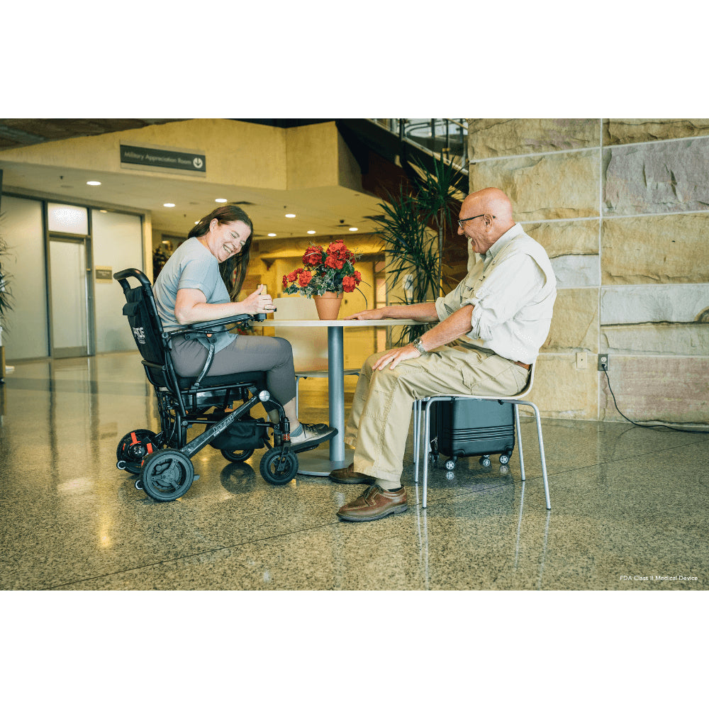 Pride Jazzy Carbon Lightweight Power Wheelchair in the Cafeteria