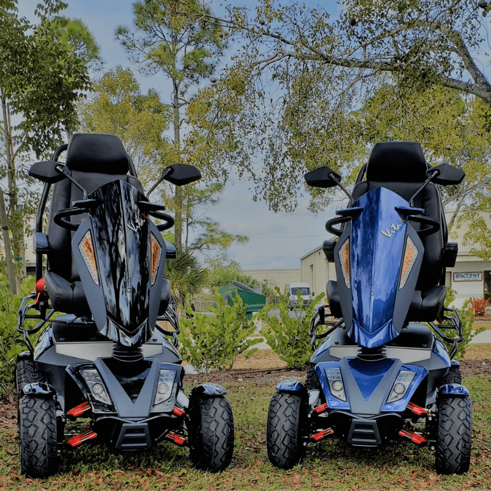Blue and Black EV Rider Heartway S12X Vita Monster Mobility Scooter in the garden