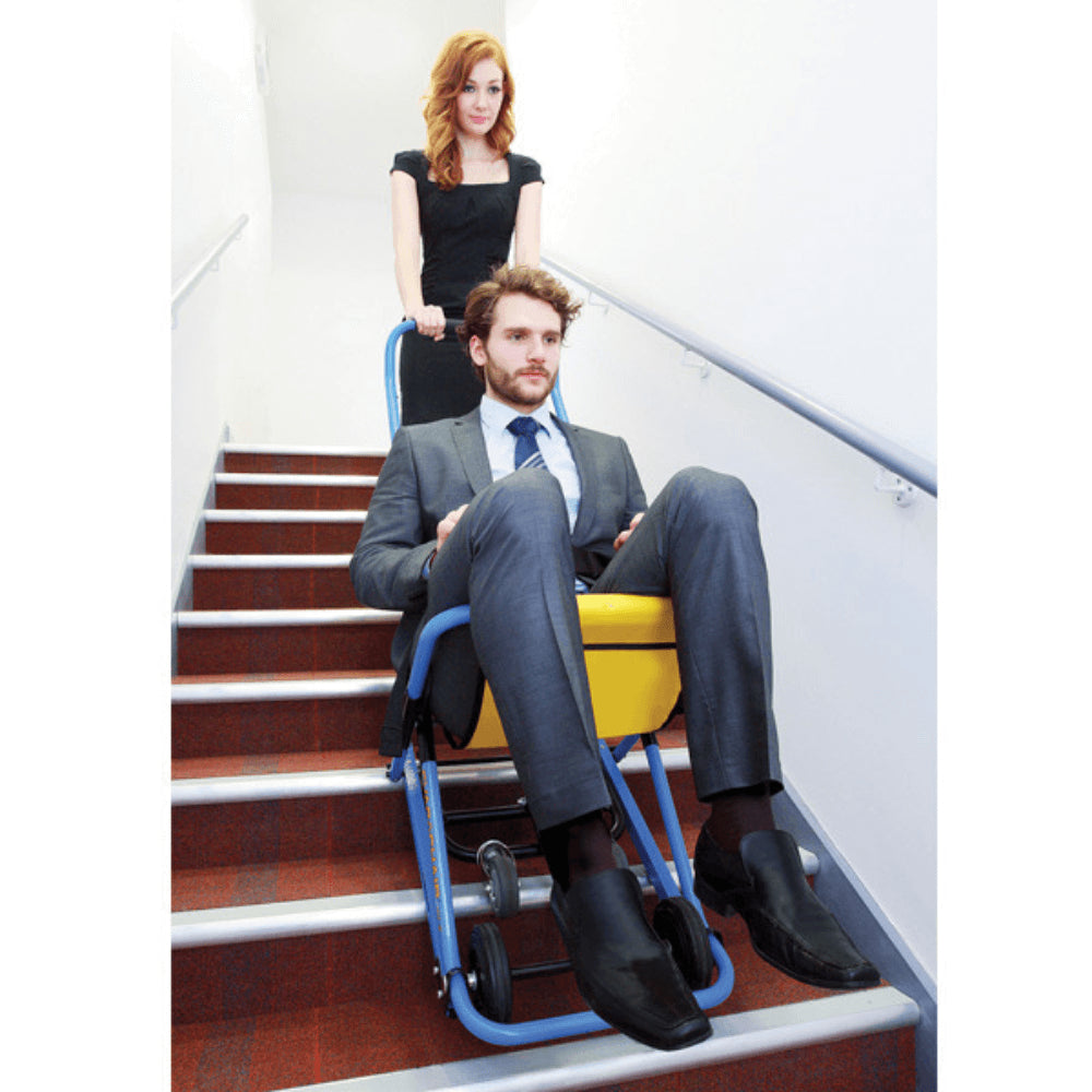 EVAC+CHAIR 300H Lightweight Emergency Stair Chair - Patient being safely assisted downstairs