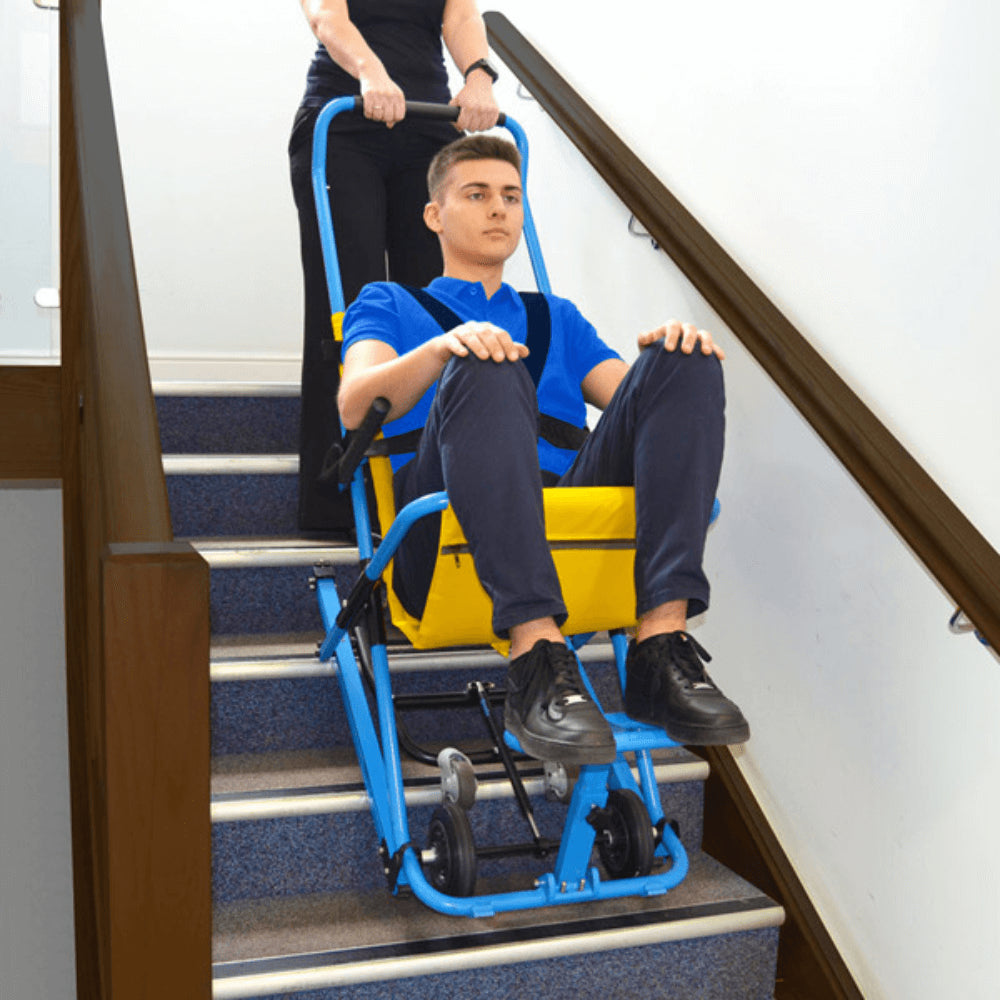 EVAC+CHAIR 400H Emergency Stair Chair - Patient being safely assisted downstairs
