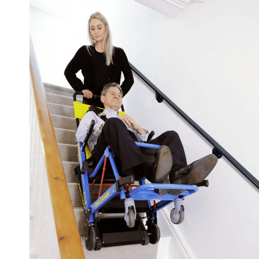 EVAC+CHAIR Power 900 Battery Operated Electric Evacuation Chair - Patient being safely assisted downstairs