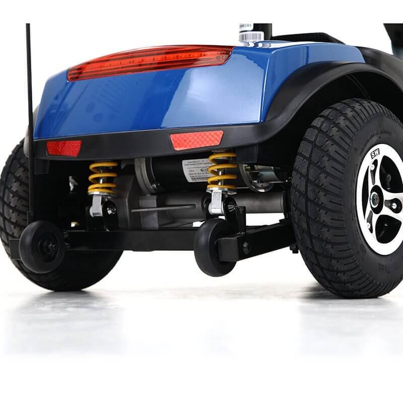 Red Metro Mobility Patriot 4-Wheel Travel Mobility Scooter - Rear Wheel Close-up View