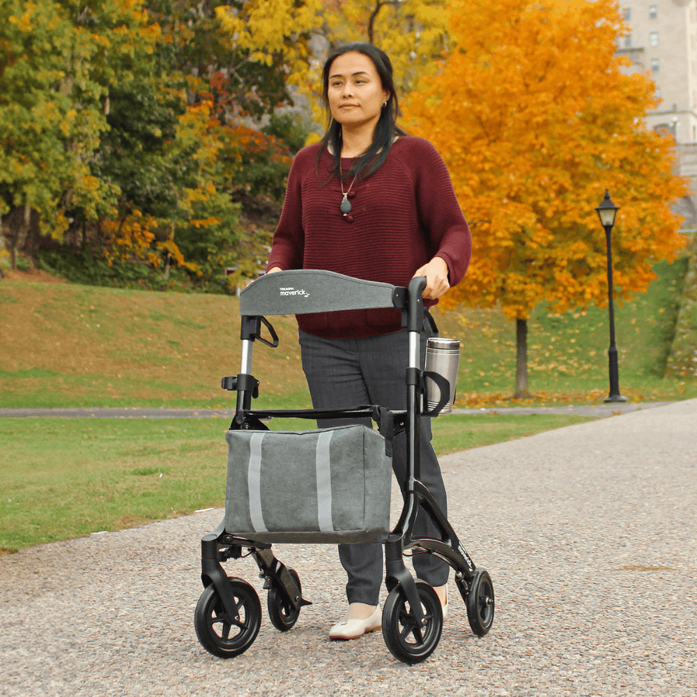 Triumph Mobility Maverick Carbon Fibre Rollator - Lady using the rollator in the pavement