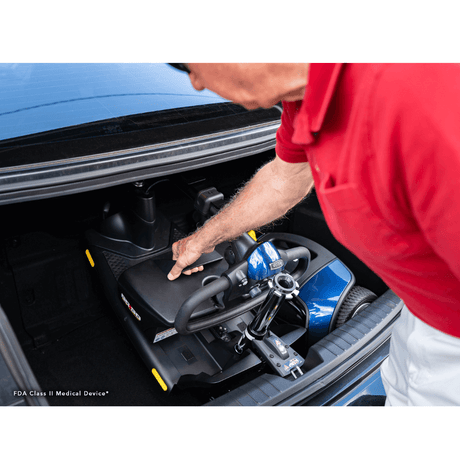 Blue Pride Go Go Elite Traveller® 3-Wheel Scooter 18AH Battery in the Trunk of a Car