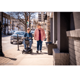 Pride Go Go Elite Traveller® 2 Mobility Scooter using in the walkway