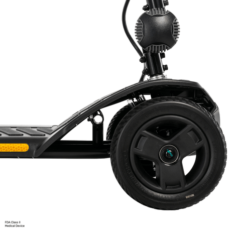 Pride Go Go® Ultra X Gen 3 4-Wheel Mobility Scooter In black Color -  Front Wheel Closeup View