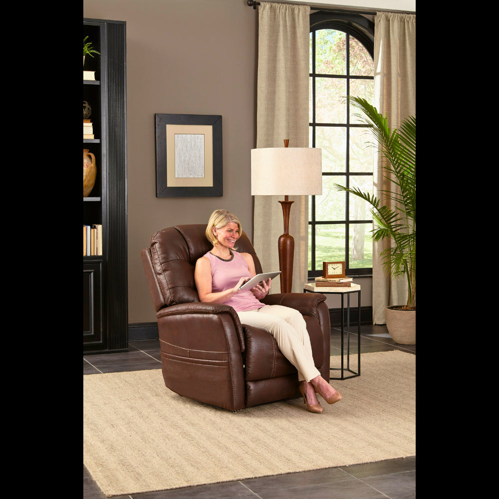 A Happy Woman Sitting in a Badlands Walnut Pride Mobility Vivalift Elegance 2 PLR-975 Lift Chair 