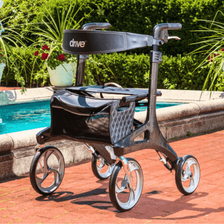 Drive Medical Nitro Elite Carbon Fiber Rollator Displayed by a Poolside
