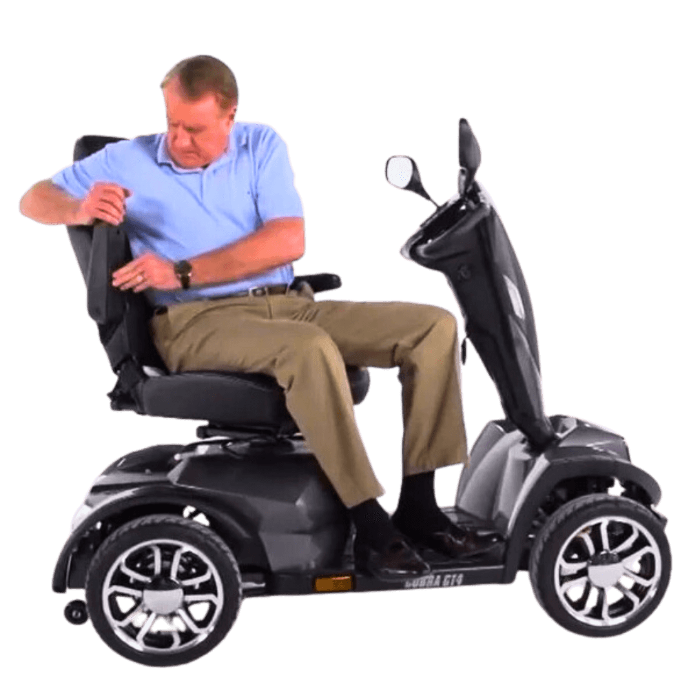 Man Adjusting Armrest of Drive Medical Cobra Gt4 Heavy Duty Power Mobility Scooter