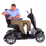 Man Adjusting Armrest of Drive Medical Cobra Gt4 Heavy Duty Power Mobility Scooter