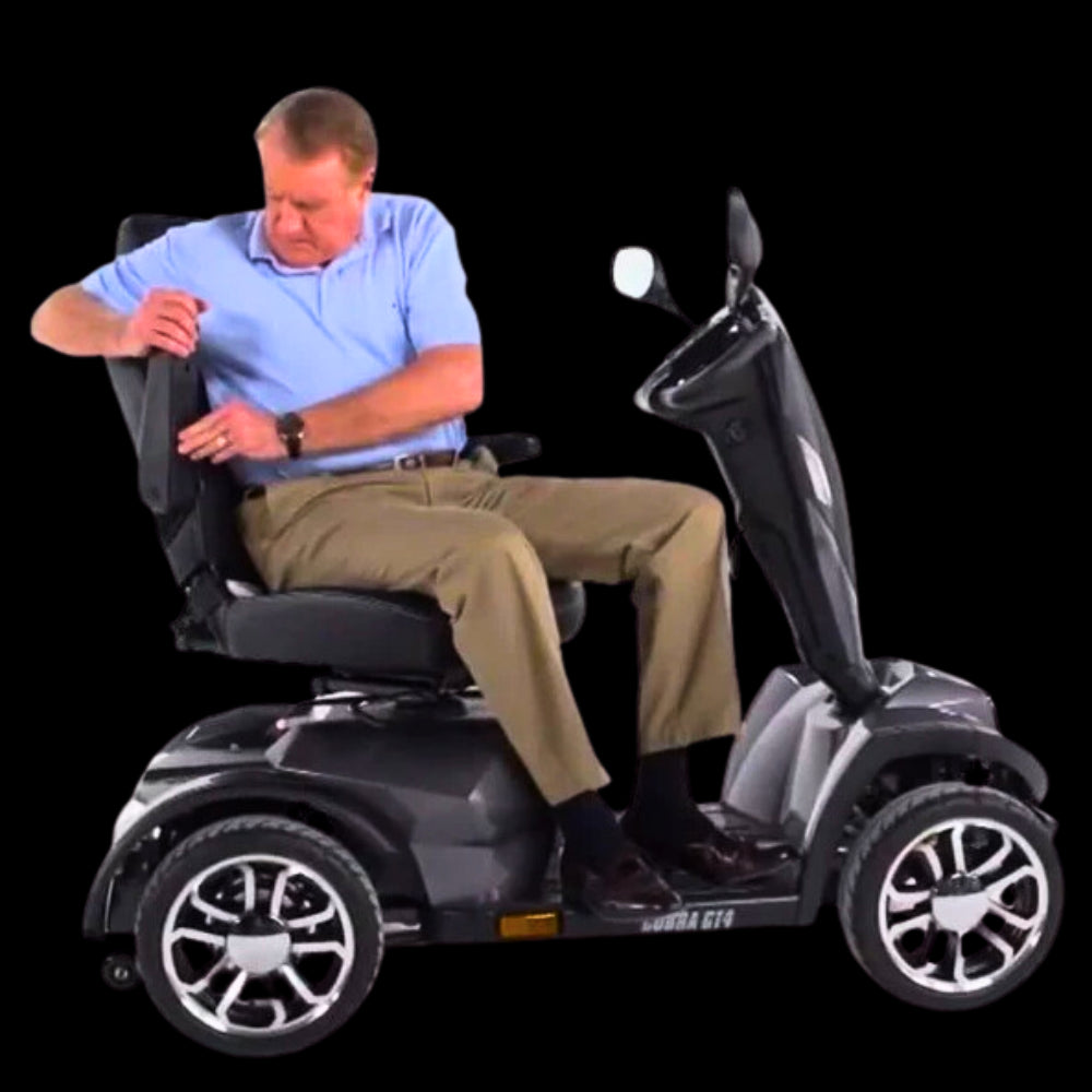 Man Adjusting Armrest of Drive Medical Cobra Gt4 Heavy Duty Power Mobility Scooter