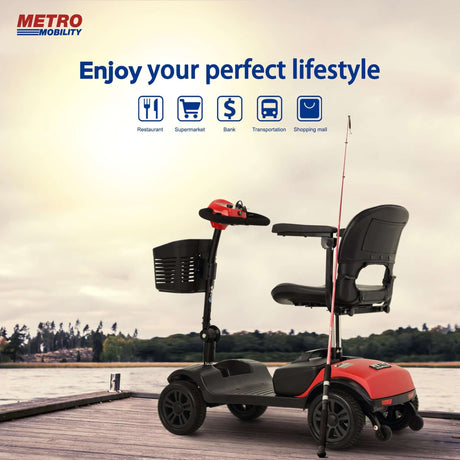 Red Metro Mobility M1 Lite Lightweight Portable Mobility Scooter on a fishing area