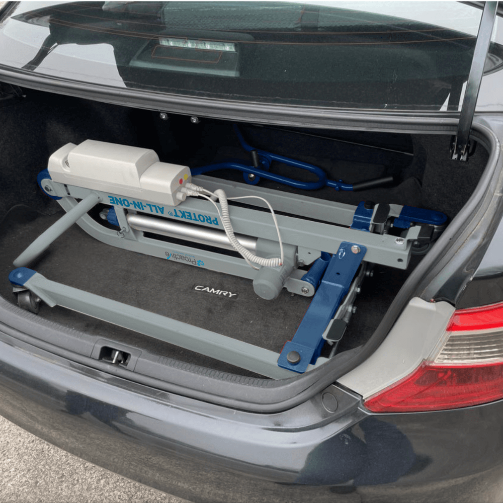 Proactive Medical Protekt All-In-One Folding Car Transfer Electric Patient Lift (350 lbs. Capacity) Folded Device in the trunk of a car