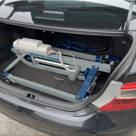 Proactive Medical Protekt All-In-One Folding Car Transfer Electric Patient Lift (350 lbs. Capacity) Folded Device in the trunk of a car