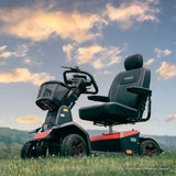 Red Color Pride PX4 All Terrain Mobility Scooter - On Grass Field