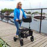Triumph Mobility Escape Adjustable Rollator - Lady using the Rollator