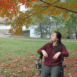 Triumph Mobility Maverick Carbon Fibre Rollator - Lady sitting on the Rollator