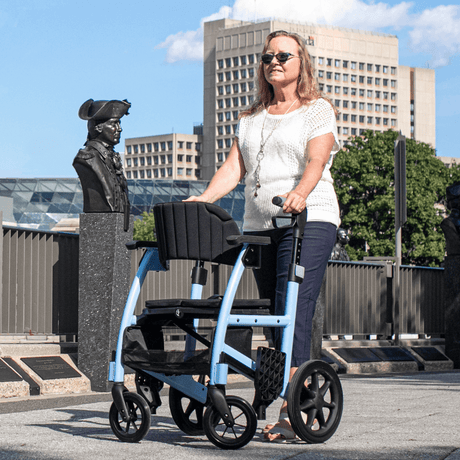 Sky Blue Color Triumph Mobility Prestige All-in-one Rollator and Transport Chair - Lady using the Rollator